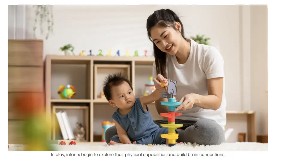 Infants playing with toys