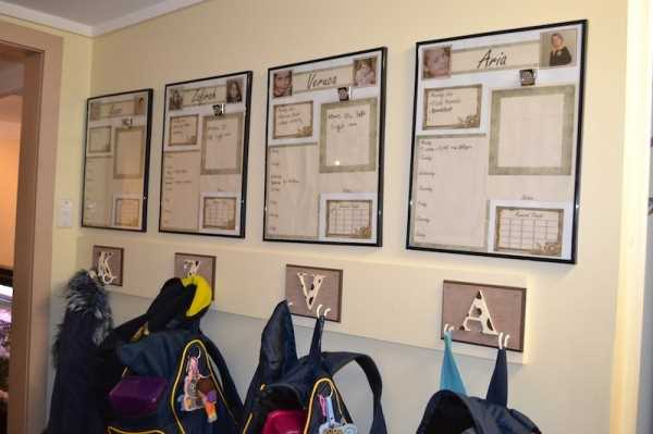 Organised school bags on wall hooks