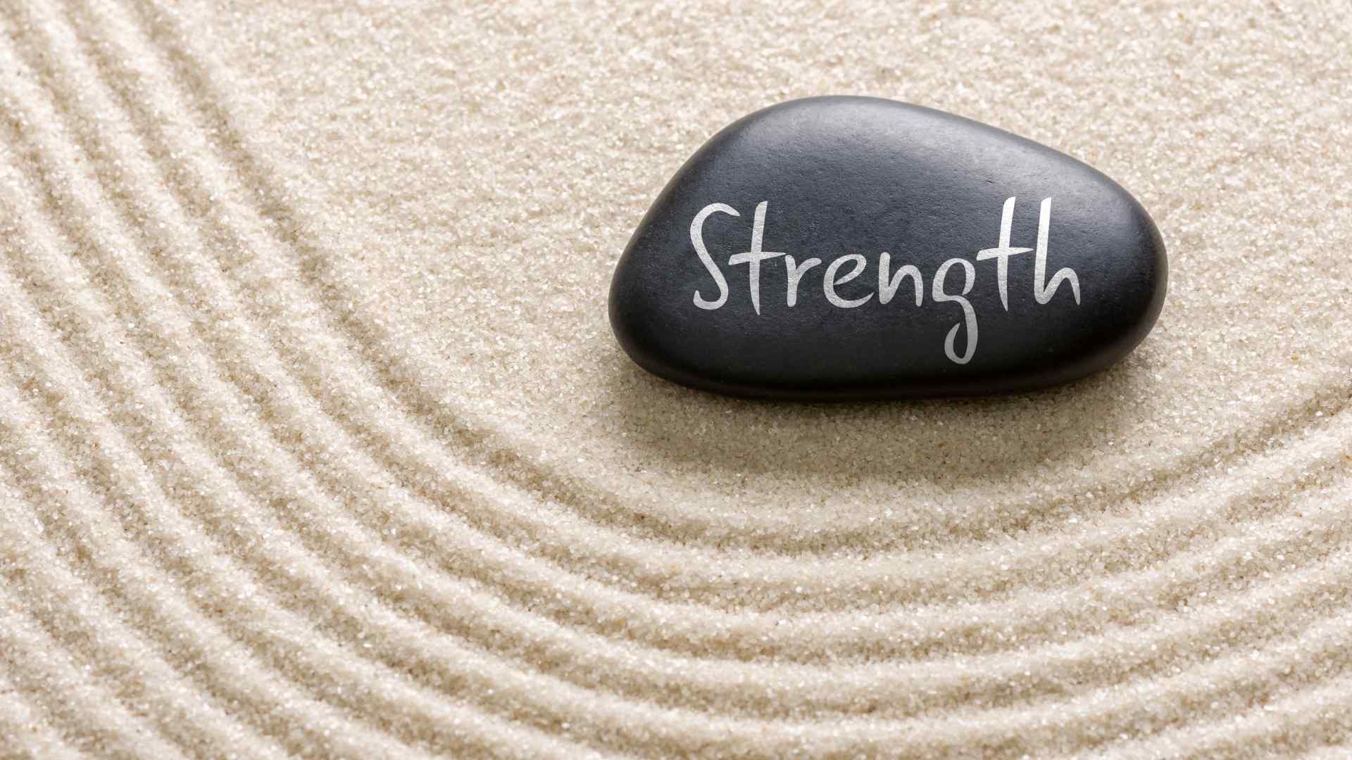 Image of rock with strength written