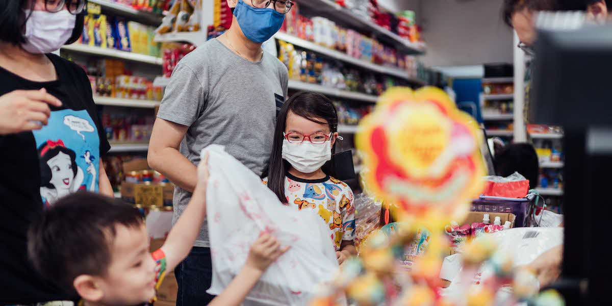 child hold plastic bag supermarket