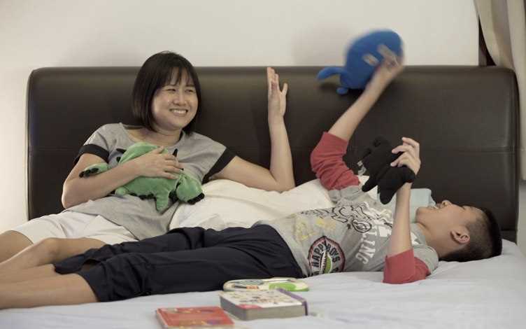 Wei Ping and her son Hong Yang at home